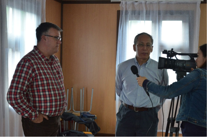 August 2015, Graham Hill, President & CEO and Yury Petrov, General Director, ZOA Prognoz, local television crew interview following bridge opening ceremony and blessing of Mangazeisky Project Chapel. 